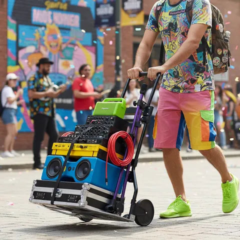 Leeyoung 264LB folding hand truck helping move items at outdoor event or party