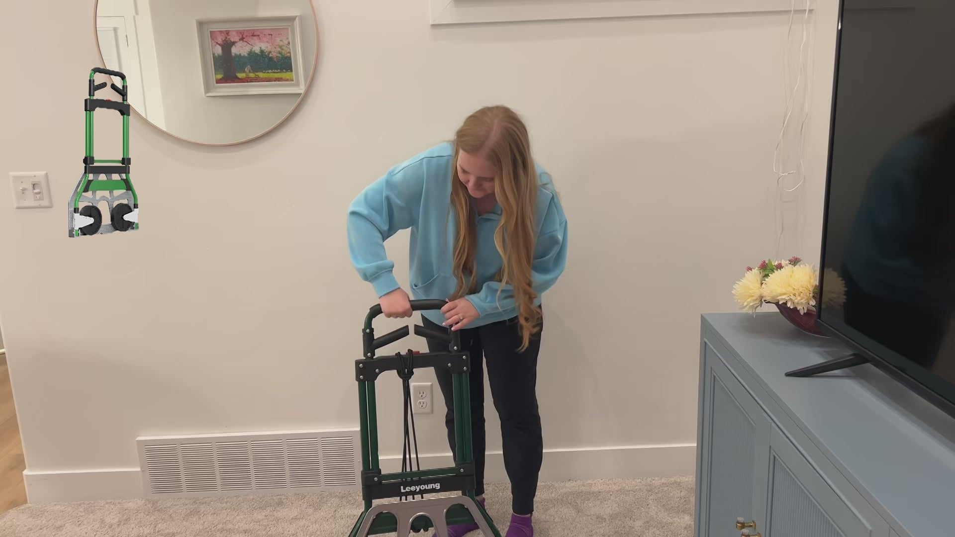 Customer showing the 375-pound capacity and foldable storage of the Leeyoung hand truck